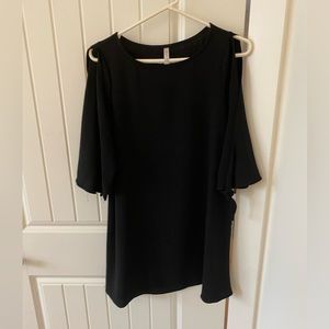 Little Black Dress. Short, cut outs in sleeves. Size S/M Above the knee.